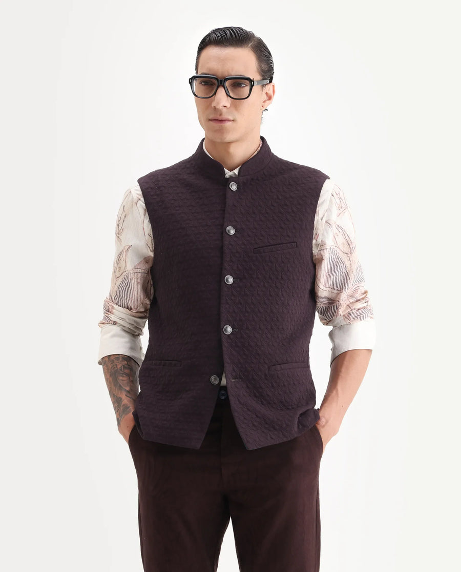 Rare Rabbit Men's Mitzi Dark Maroon Cotton Jacquard Tailored Fit Sleeveless Mandarin Collar Bandhgala Rare Rabbit Men's Lasmos-B1 Beige Viscose Embroidered Regular Fit Sleeveless Mandarin Collar Bandhgala Nehru Jacket