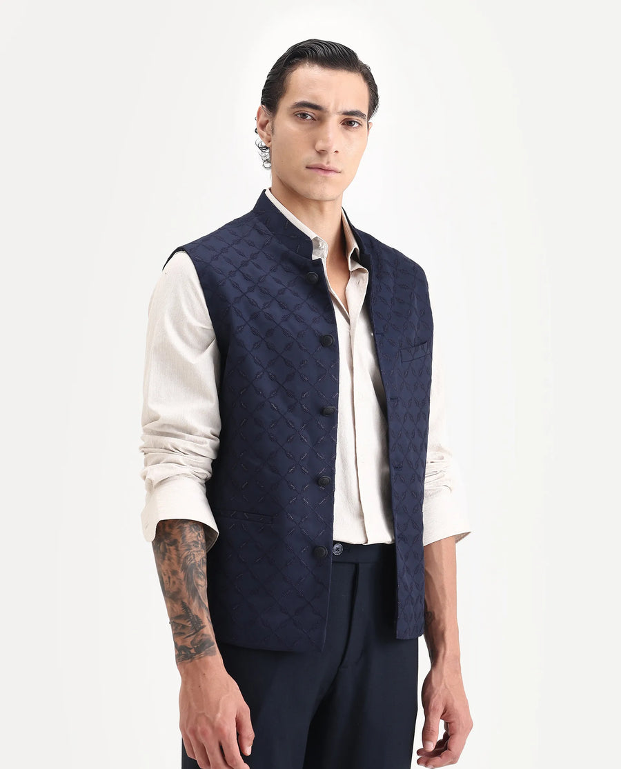 Rare Rabbit Men's Medob Dark Navy Viscose Embroidered Tailored Fit Sleeveless Mandarin Collar Bandhgala Rare Rabbit Men's Lasmos-B1 Beige Viscose Embroidered Regular Fit Sleeveless Mandarin Collar Bandhgala Nehru Jacket