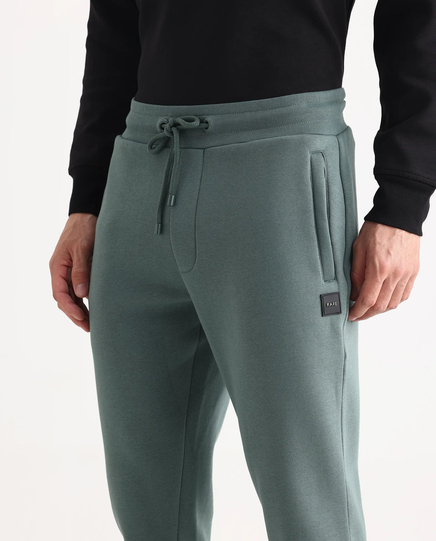 Rare Rabbit Men's Anderson-B25 Dusky Green Cotton Blend Fabric Regular Fit Badge Print Joggers