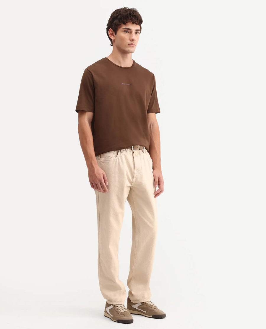 Rare Rabbit Men's Arvin Light Beige Cotton Fabric Shank And Zipper Kurt Carrot Plain Jeans