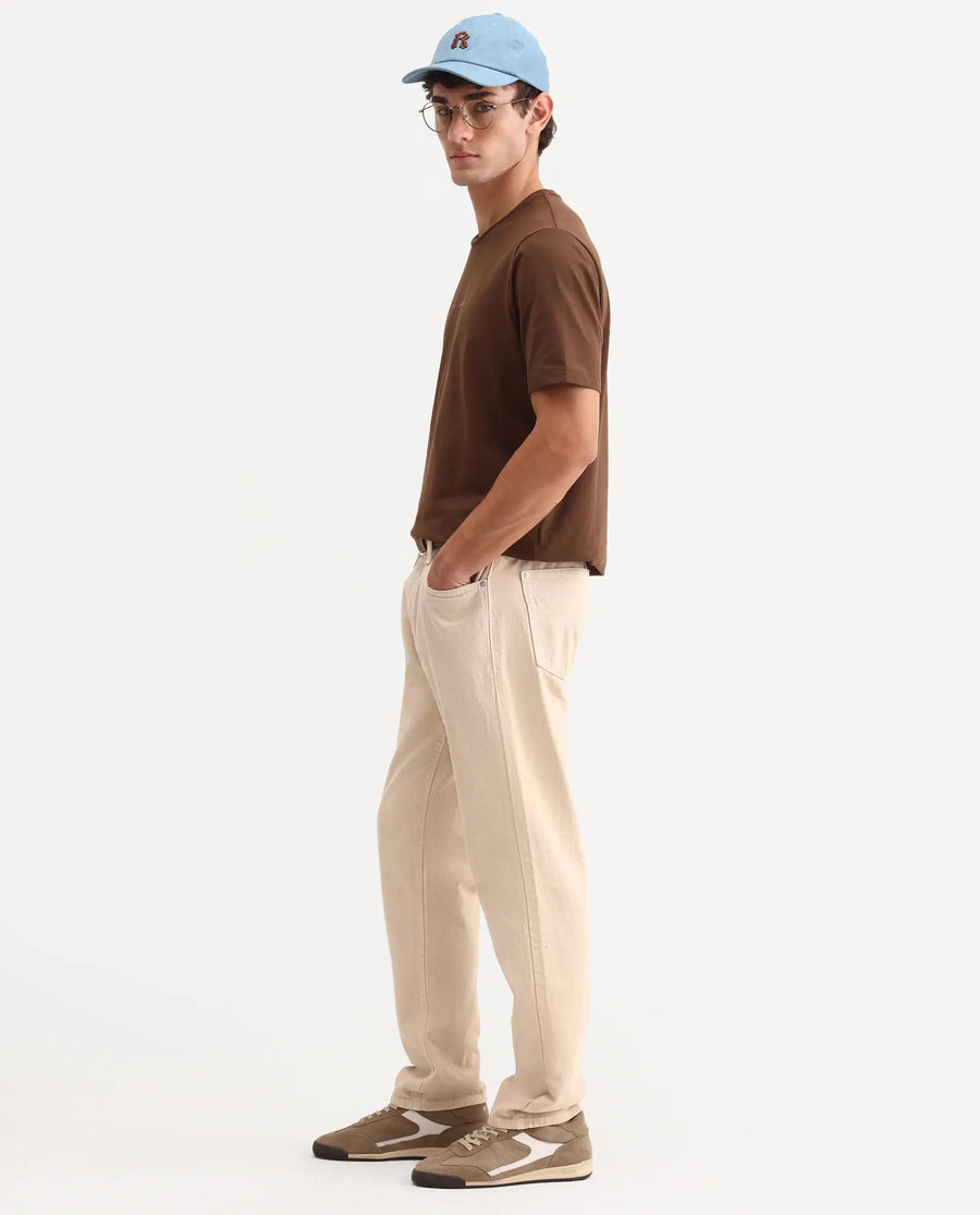 Rare Rabbit Men's Arvin Light Beige Cotton Fabric Shank And Zipper Kurt Carrot Plain Jeans