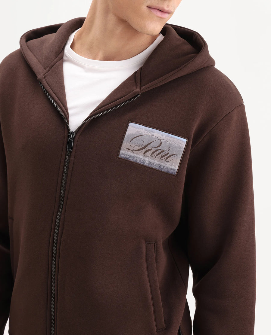 Rare Rabbit Men's Bien Dark Brown Cotton Blend Fabric Full Sleeves Hooded Zipper Closure Label Print Sweatshirt