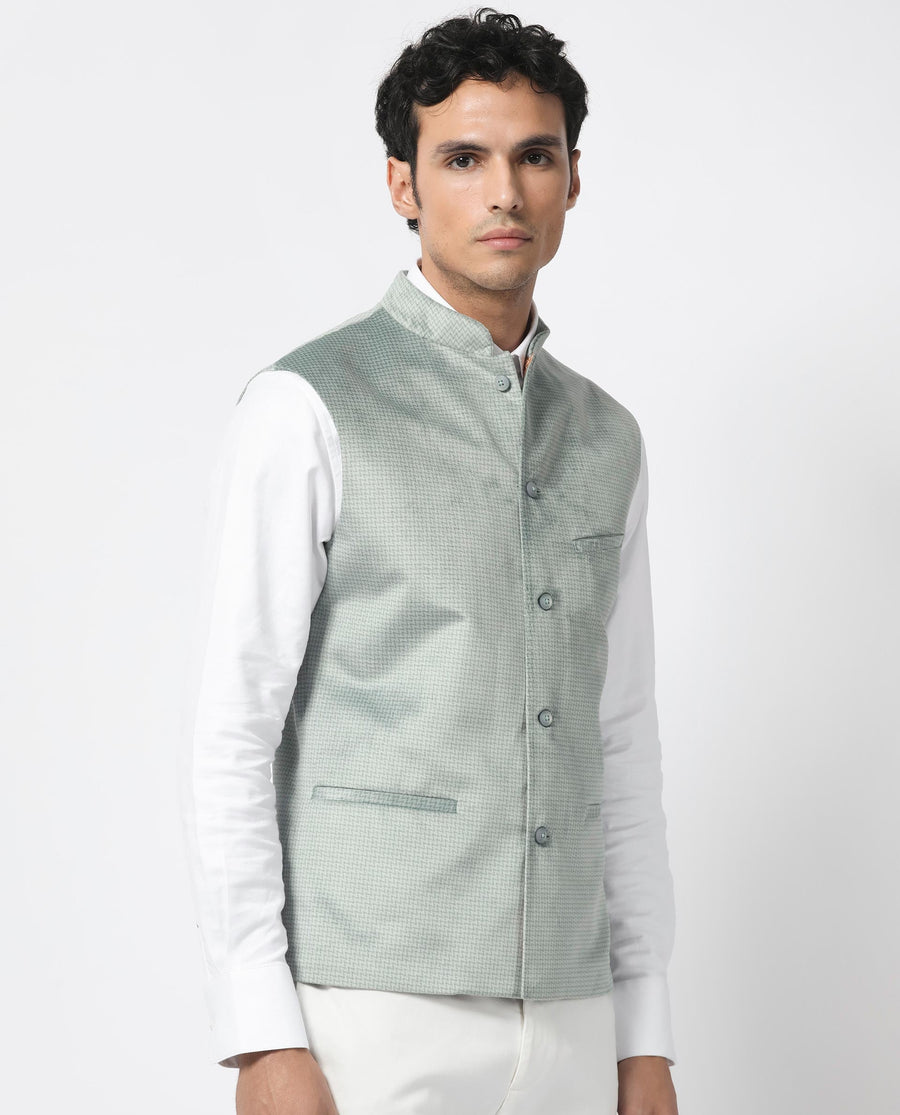 Rare Rabbit Men's Emerald Light Blue Polyester Plain Tailored Fit Sleeveless Mandarin Collar Bandhgala Rare Rabbit Men's Lasmos-B1 Beige Viscose Embroidered Regular Fit Sleeveless Mandarin Collar Bandhgala Nehru Jacket