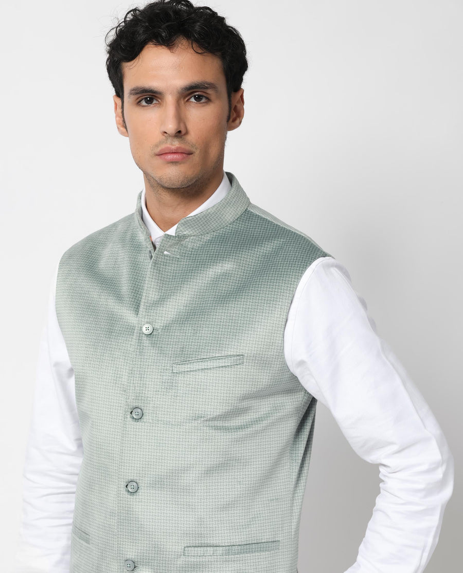 Rare Rabbit Men's Emerald Light Blue Polyester Plain Tailored Fit Sleeveless Mandarin Collar Bandhgala Rare Rabbit Men's Lasmos-B1 Beige Viscose Embroidered Regular Fit Sleeveless Mandarin Collar Bandhgala Nehru Jacket