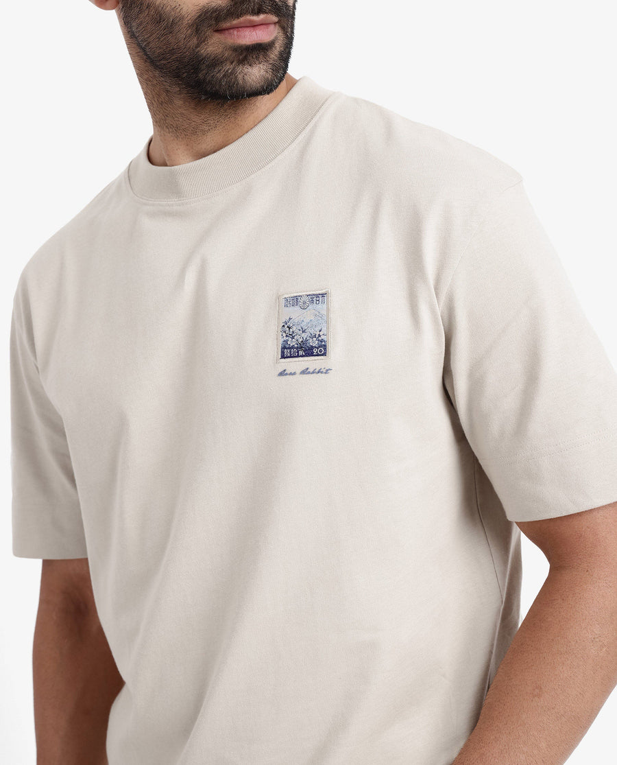 Rare Rabbit Men's Trams Beige Cotton Graphic Print Oversized Fit Half Sleeve Crew Neck T-Shirt