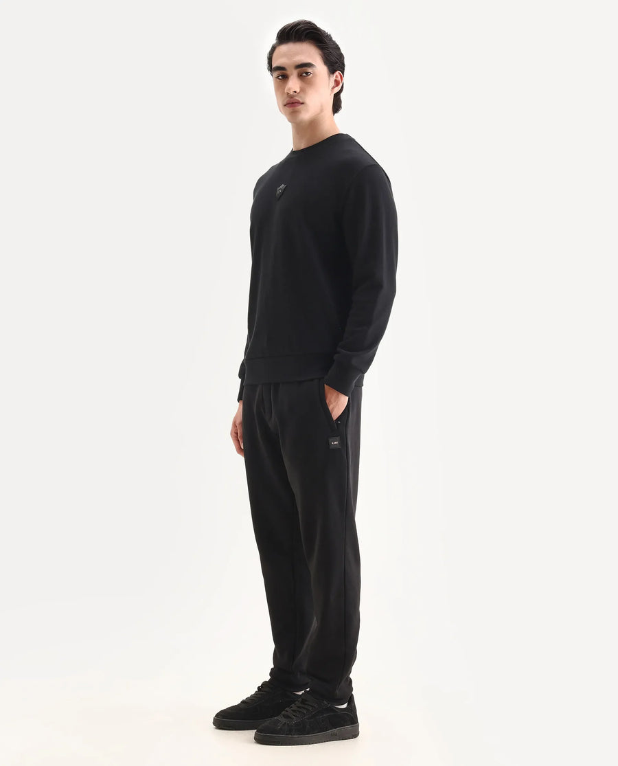 Rare Rabbit Men's Anderson-B25 Black Cotton Blend Fabric Badge Print Joggers