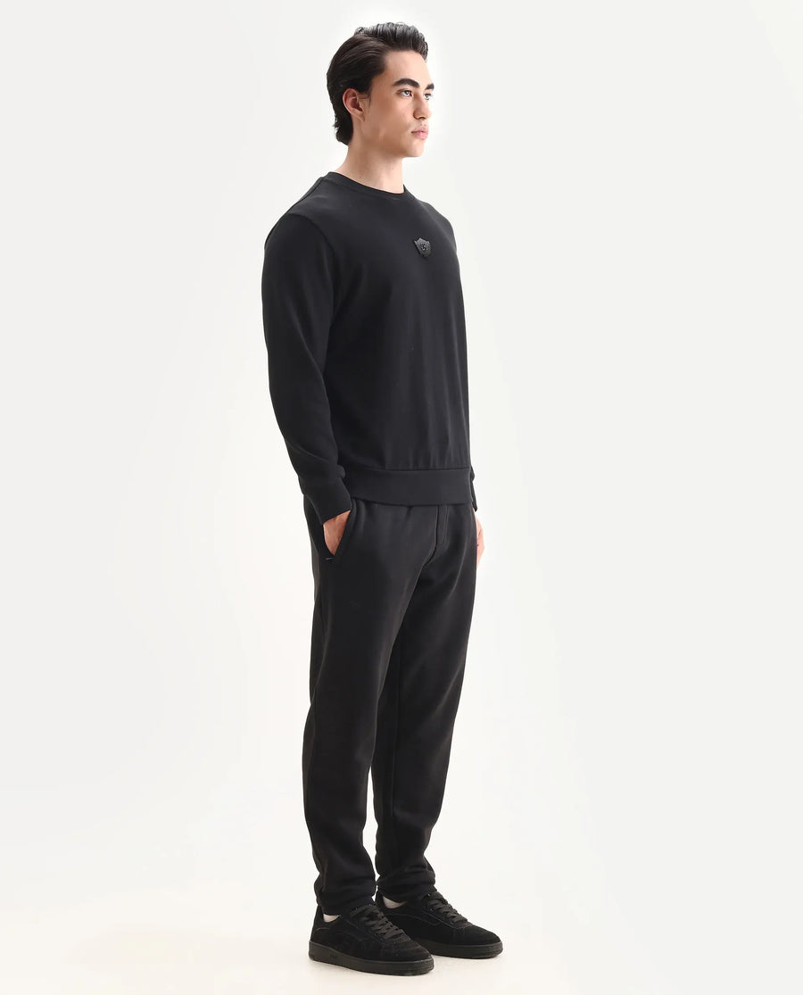 Rare Rabbit Men's Anderson-B25 Black Cotton Blend Fabric Badge Print Joggers