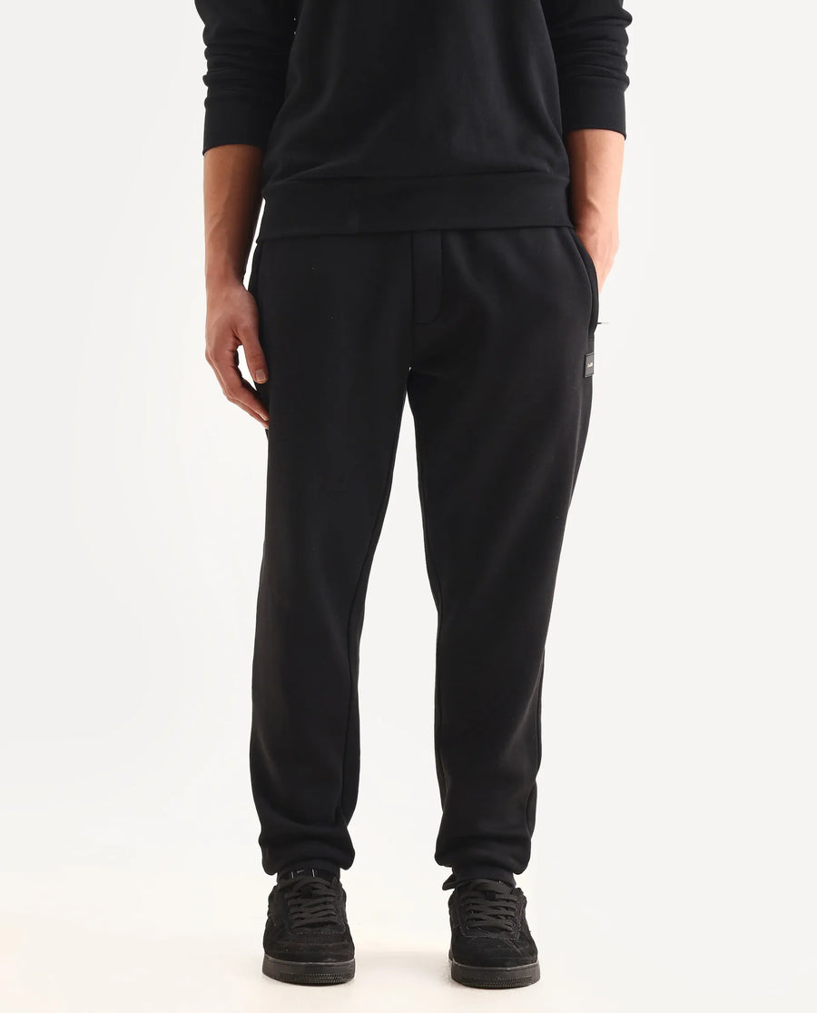 Rare Rabbit Men's Anderson-B25 Black Cotton Blend Fabric Badge Print Joggers