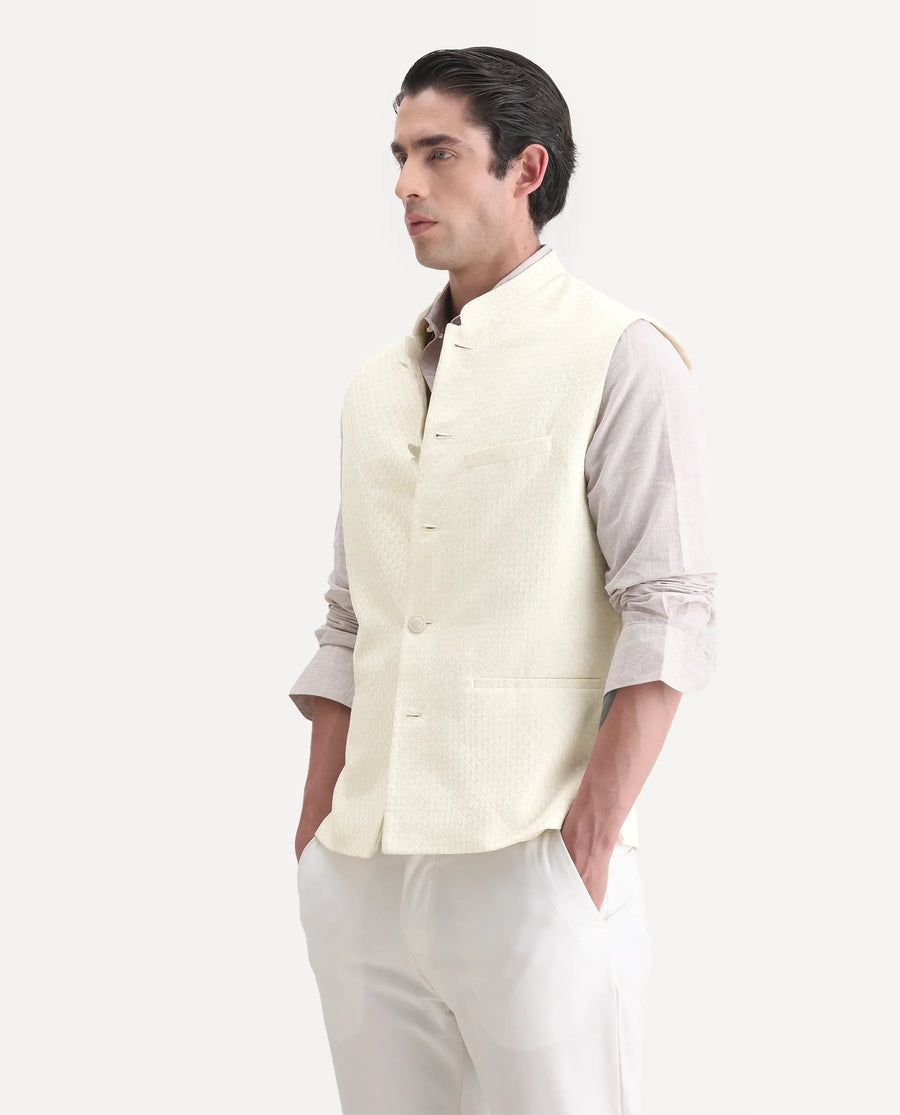 Rare Rabbit Men's Guild Festive Lasmos B1 Off White Viscose Embroidered Regular Fit Sleeveless Mandarin Collar Bandhgala Rare Rabbit Men's Lasmos-B1 Beige Viscose Embroidered Regular Fit Sleeveless Mandarin Collar Bandhgala Nehru Jacket