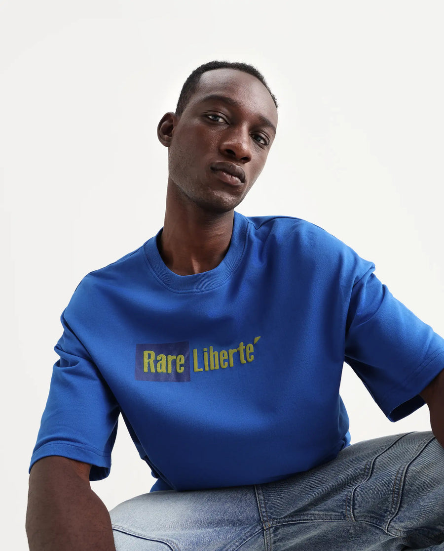 Rare Rabbit Men's Moshe Flouroscent Blue Cotton Graphic Print Oversized Fit Half Sleeve Crew Neck T-Shirt